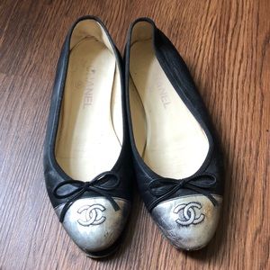 Black Chanel flats with metallic contrast toe